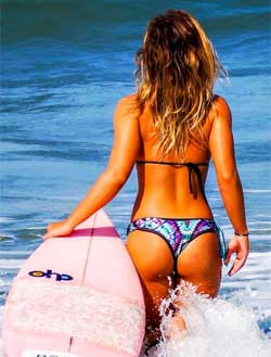 Tan Woman at Beach - Exfoliate before you tan so you get a healthier glow